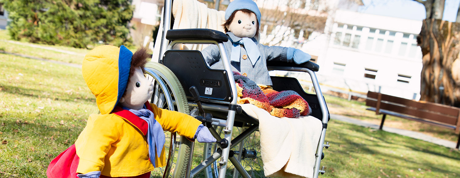 JOYK Puppen Ingrid und Marco mit Rollstuhl